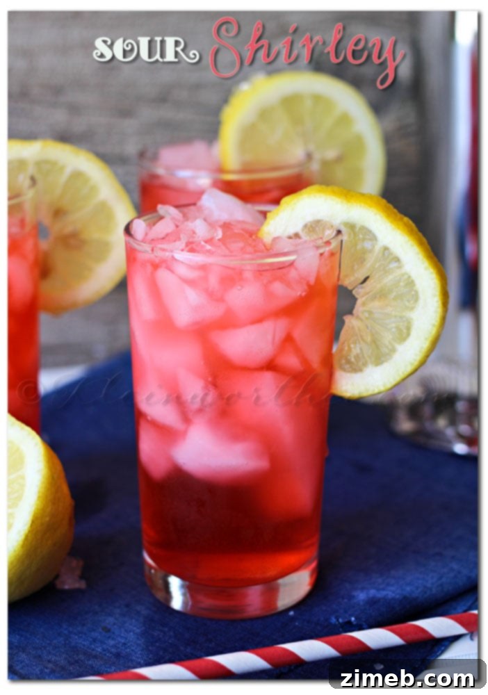 Sweeten Your Monday with a Blackberry Vanilla Mocktail 7 A vibrant red Sour Shirley Summer Drink, a classic with a zesty twist.