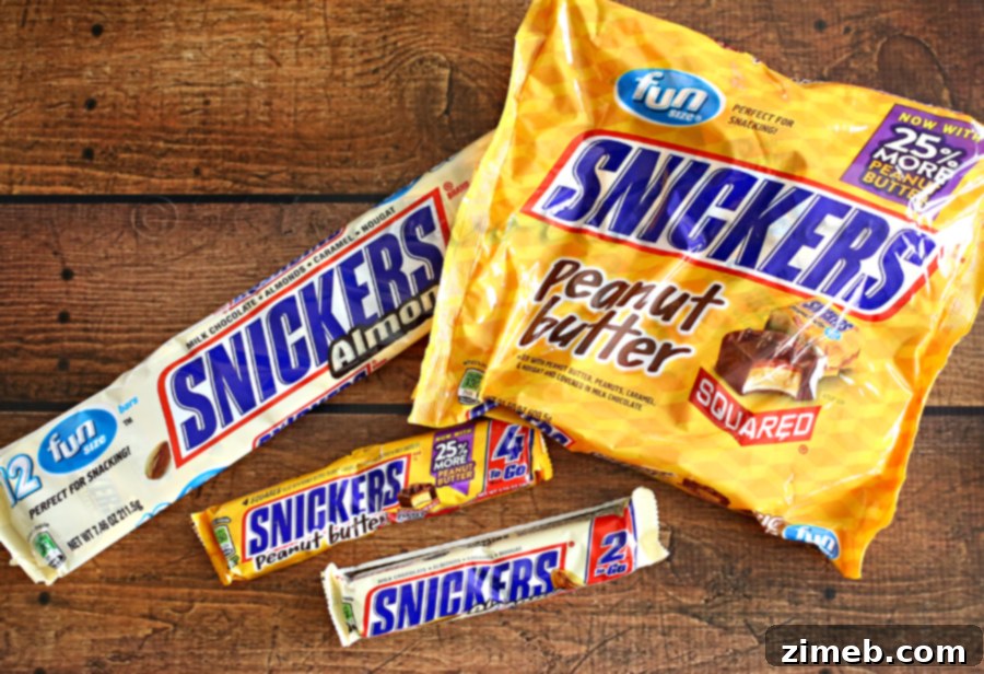 Close-up of SNICKERS® Peanut Butter Squares, emphasizing their role in a protein-rich snack mix.