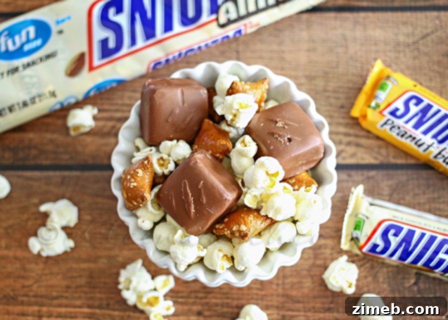A bowl of SNICKERS® Peanut Butter Snack Mix, illustrating a healthy and productive snacking habit.