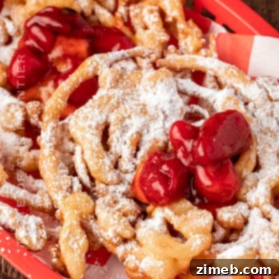 Funnel Cake with strawberry topping and whipped cream