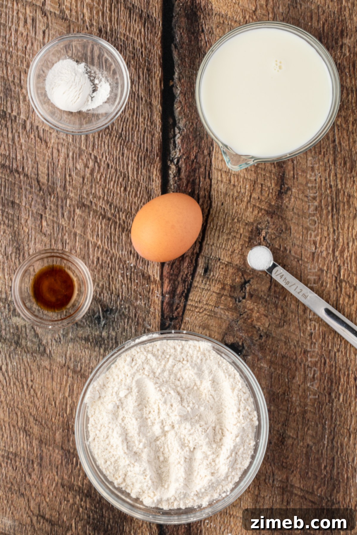 Essential ingredients for homemade Funnel Cake: flour, milk, egg, baking powder, vanilla, salt.