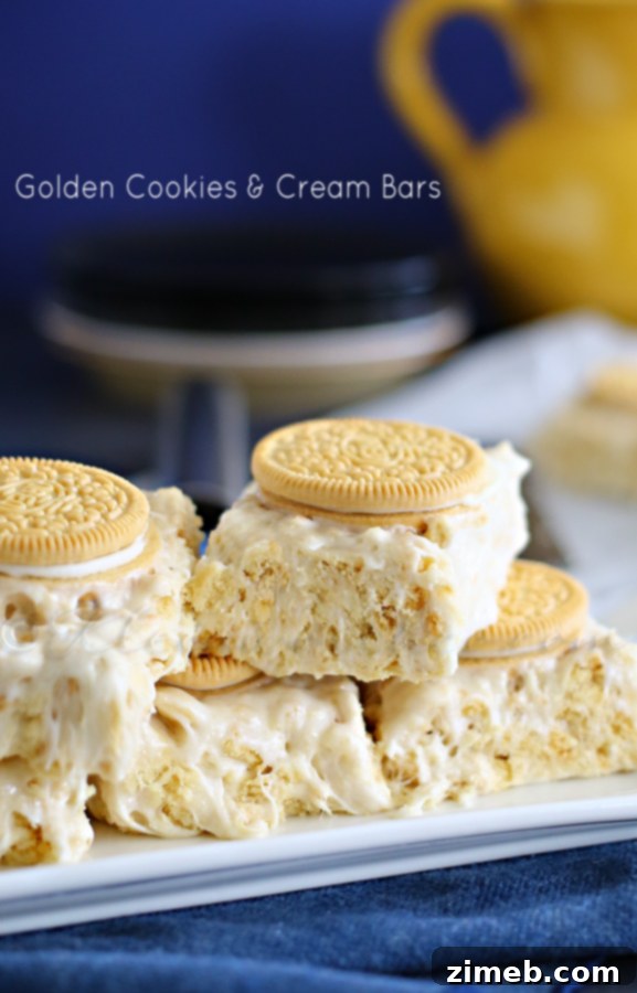 Golden Cookies & Cream Bars stacked, ready to be served as a sweet treat.