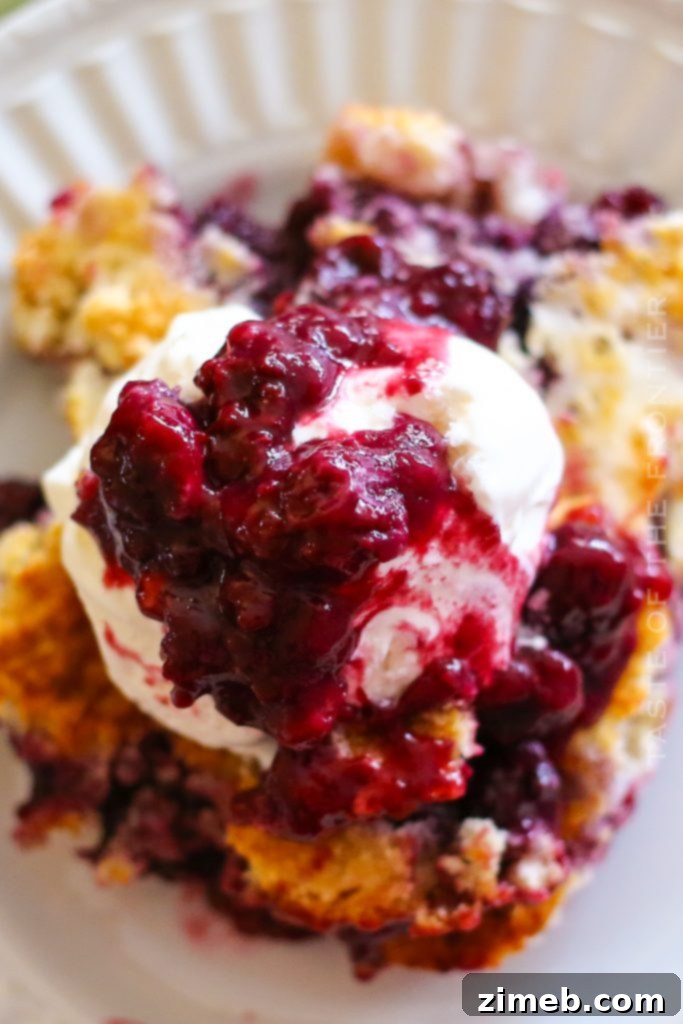 Effortless Blackberry Cobbler 4 A close-up of a rustic blackberry cobbler recipe, showing the inviting texture of the fruit and crust in a baking dish.