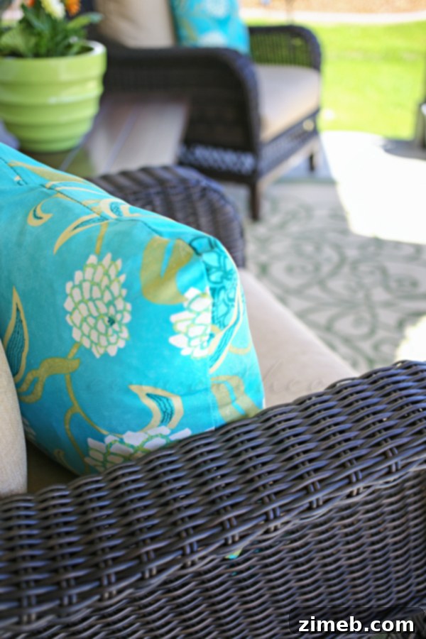 Outdoor Pillow Makeover - Assortment of custom-made outdoor pillows in various blue and green patterns.