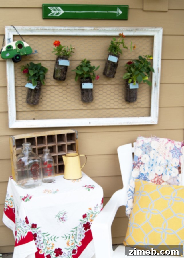 Mason Jar Wall Garden - A creative vertical garden using mason jars for herbs or flowers.