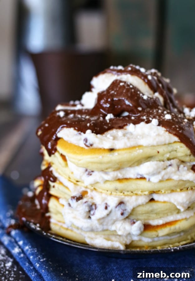 Delicious Cannoli Pancakes stacked high with filling and chocolate chips