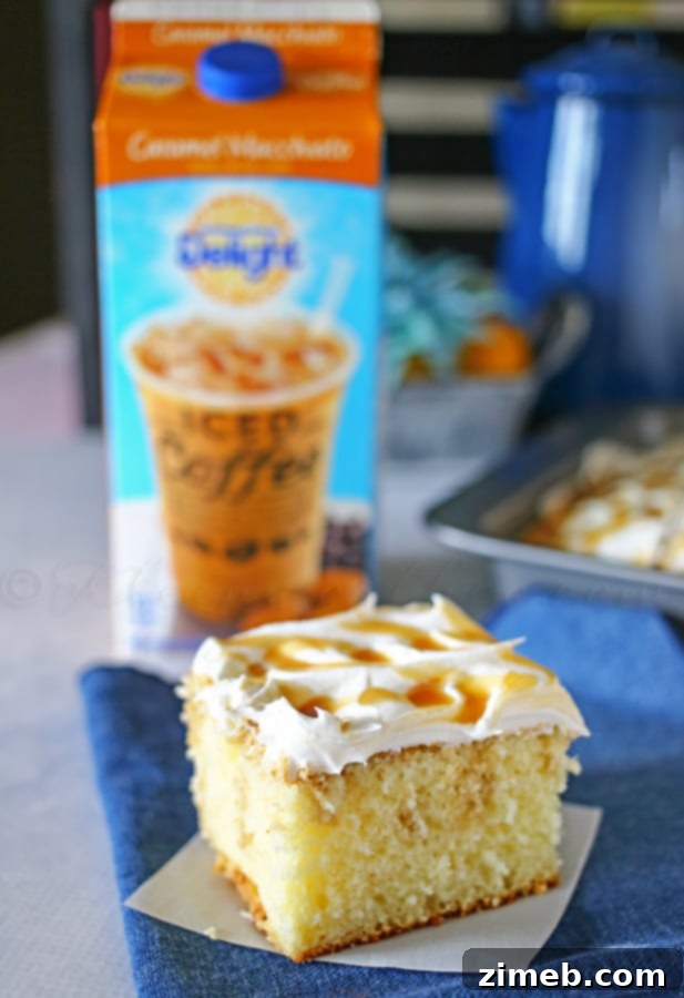 Creamy Caramel Macchiato Poke Cake 4 Caramel Macchiato Poke Cake on a cooling rack, freshly drizzled