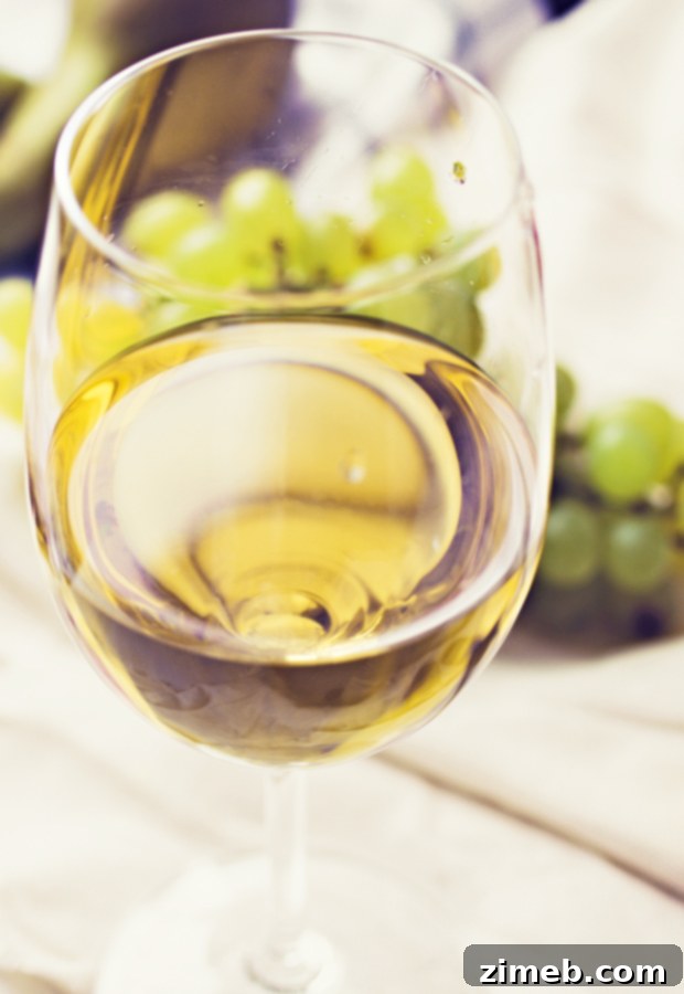 Uncorked Romance: Backyard Picnic Date 5 Close-up of a hand holding a glass of The Seeker Wines at a backyard picnic