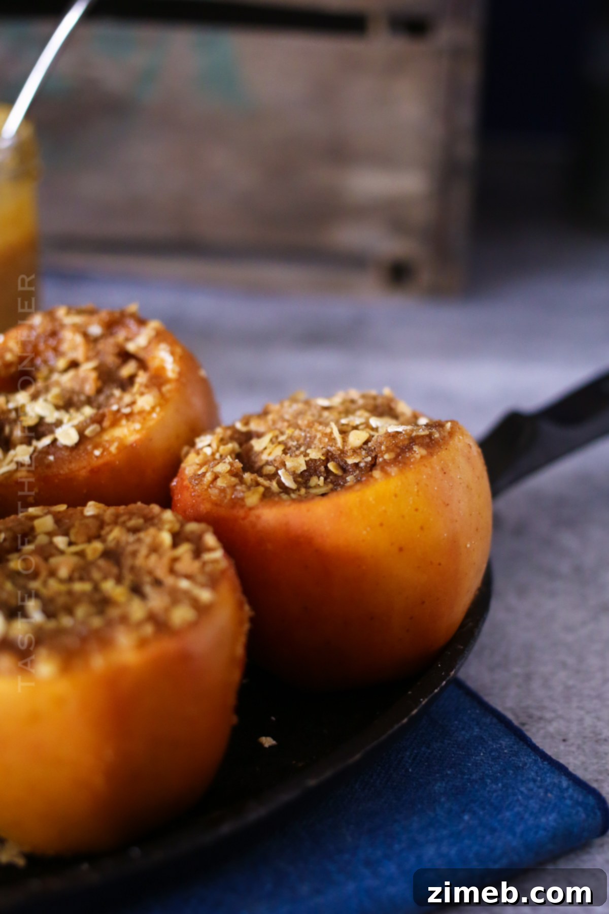 A close-up of a baked apple with caramel drizzle, labeled as 'Baked Apple Recipe'.
