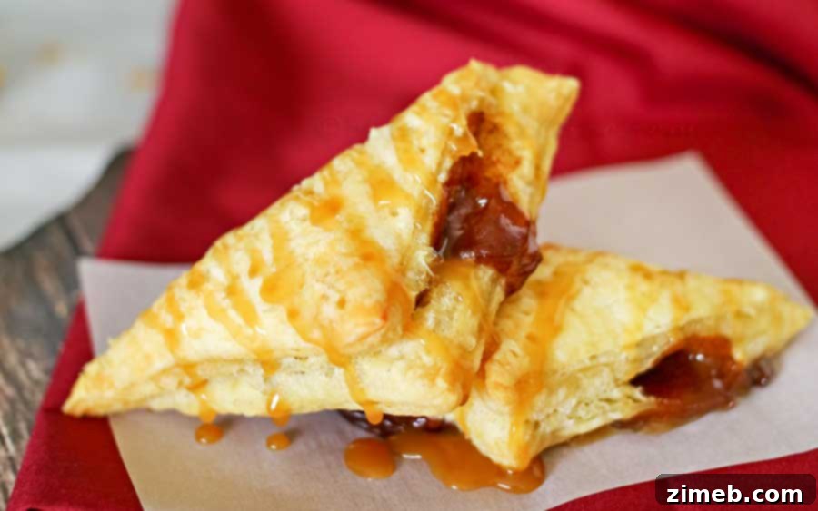 Close-up of baked Caramel Apple Turnovers with caramel drizzle