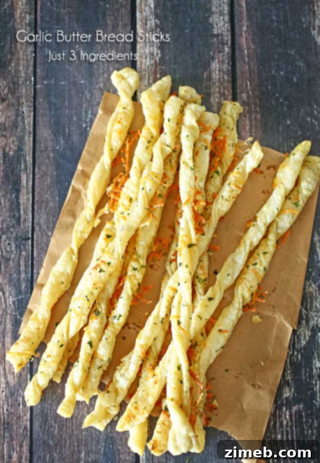 Golden brown Italian Garlic Butter Bread Sticks on a baking sheet
