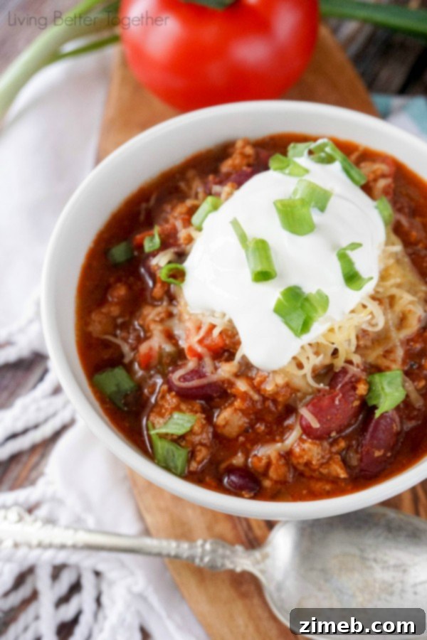 Bowl of Healthy Easy Turkey Chili garnished with toppings