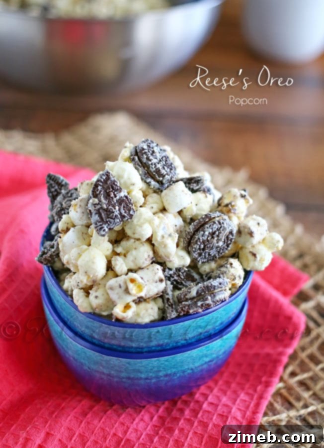 Close-up of Reese's Oreo Popcorn, a sweet and salty treat perfect for sharing at a tailgate party.