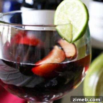 Finished Halloween Sangria in glasses with fruit and spooky decor