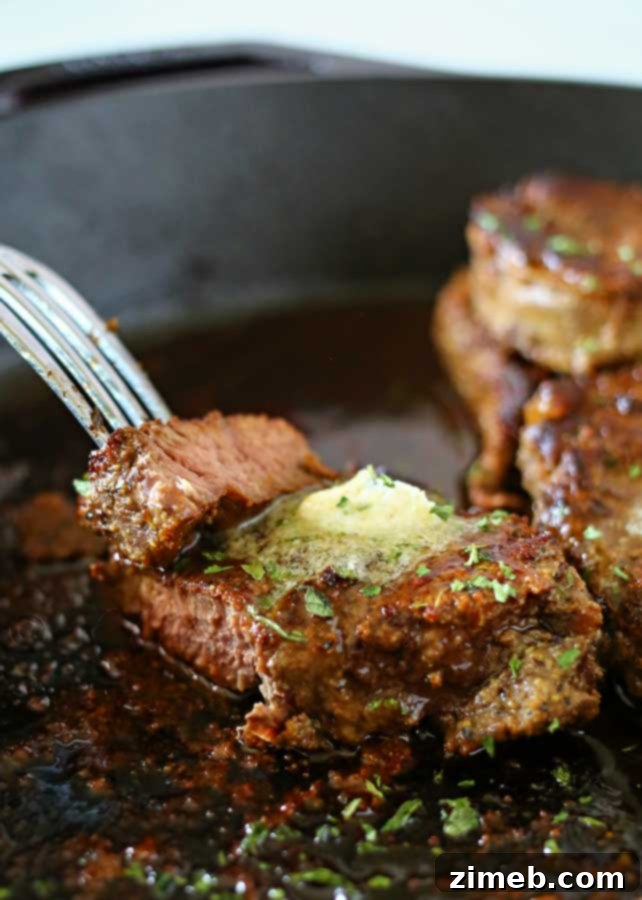 Decadent Garlic Butter Filet Mignon 4 Garlic Butter Filet Mignon in a cast iron skillet, showcasing a perfect sear and inviting aroma.