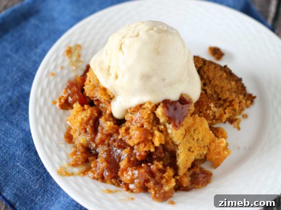 Close-up of Peanut Butter Apple Dump Cake in slow cooker, showing melted chips and golden crust