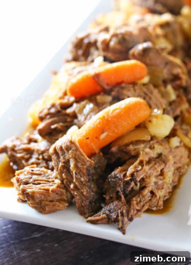 Tender and flavorful Instant Pot Rump Roast, ready to be shredded.