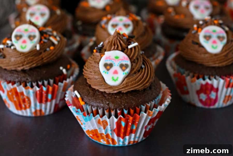 Close-up of Sugar Skull Cupcakes with festive wrappers and toppers