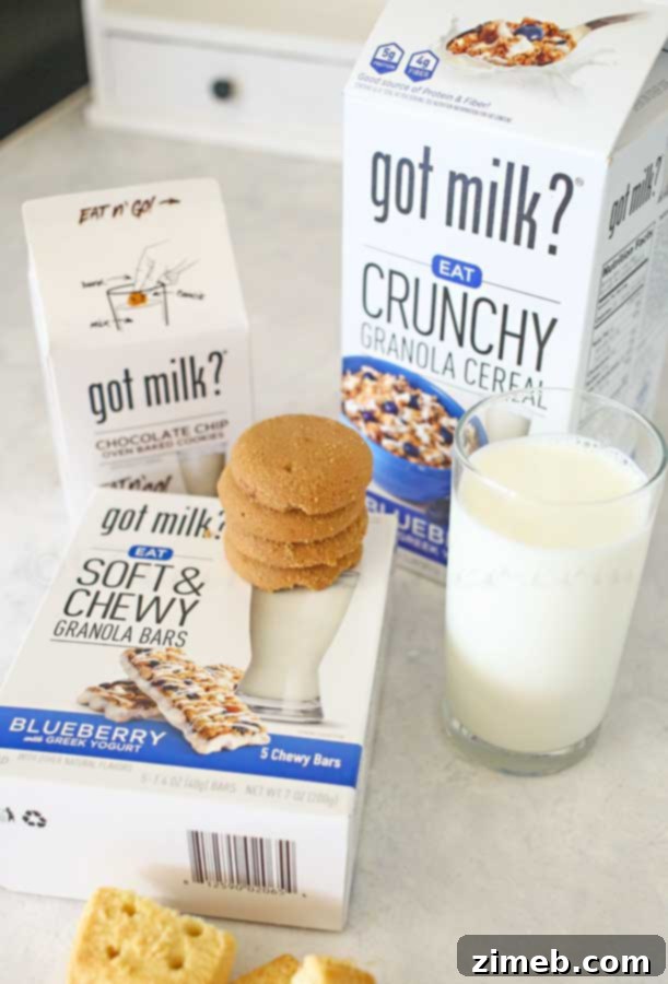 Milk Matters 2 A refreshing glass of milk next to a variety of Got Milk? snack products, symbolizing health and convenience.