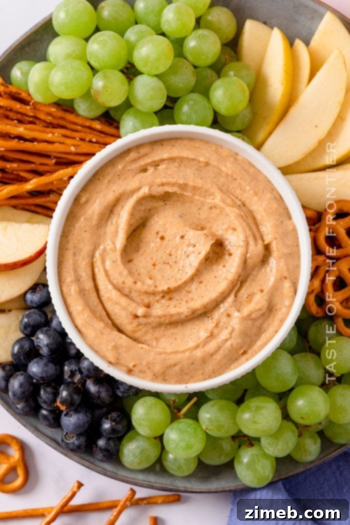Pumpkin Pie Dip 3 A vibrant fall snack tray featuring the creamy pumpkin dessert dip surrounded by dippable treats.