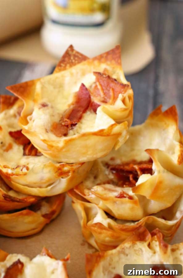 Creamy Bacon Alfredo Cheese Cups 4 Platter of golden brown Bacon Alfredo Cheese Cups, ready to serve as a crowd-pleasing appetizer.