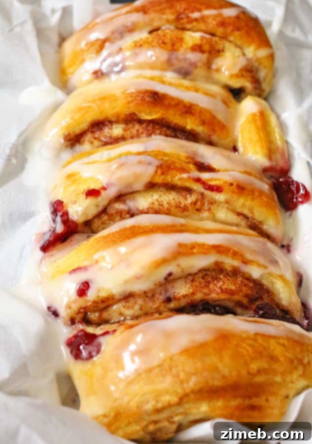 Cranberry Cinnamon Swirl Bread 5 Cranberry Cinnamon Roll Loaf, sliced and ready to serve.