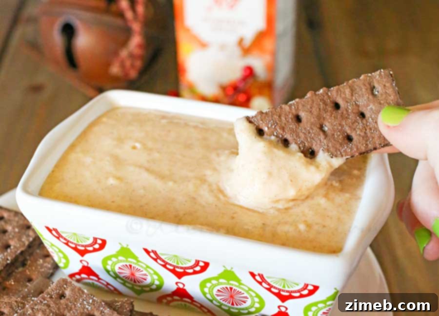 Creamy Dairy-Free Eggnog Dip 4 Close-up of creamy Dairy Free Eggnog Dip in a glass bowl, garnished with cinnamon
