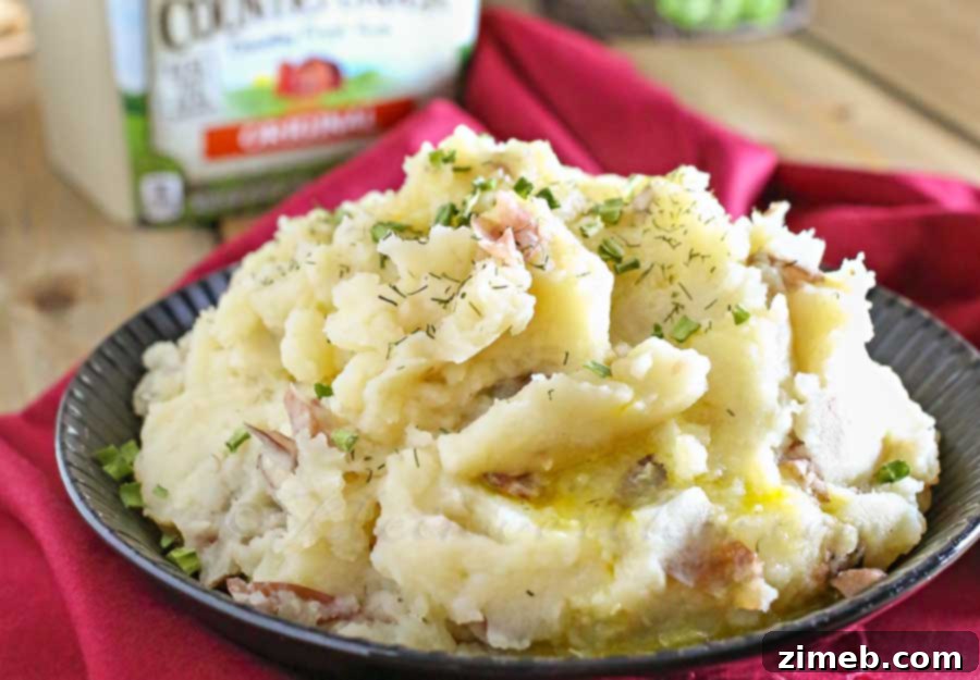 Effortless Slow Cooker Mashed Potatoes 4 Close-up of fluffy Crock Pot Mashed Potatoes in a bowl.