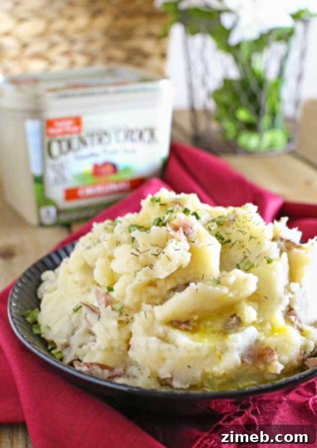 Effortless Slow Cooker Mashed Potatoes 5 Crock Pot Mashed Potatoes with chives, ready to serve.