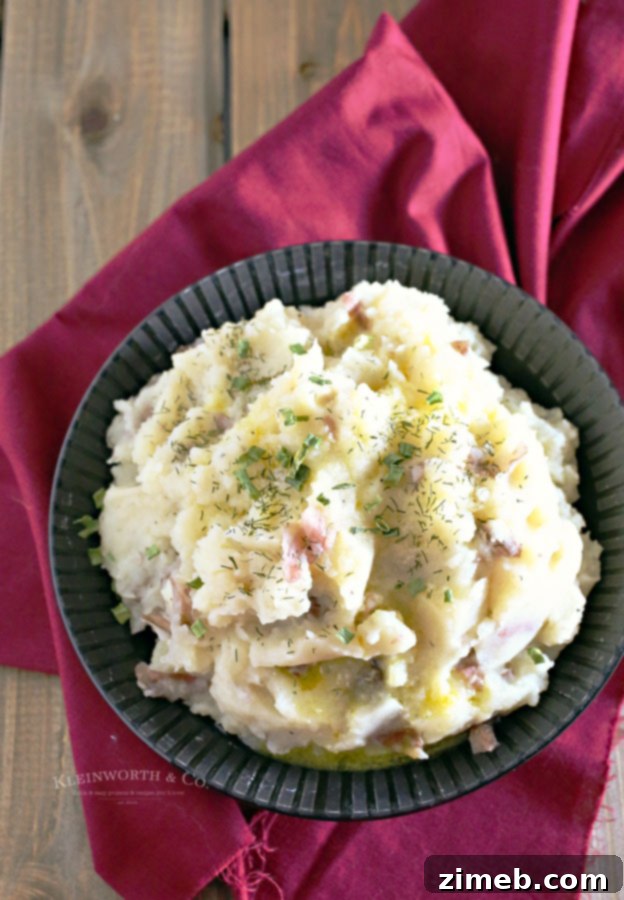 Effortless Slow Cooker Mashed Potatoes 6 Serving of Slow Cooker Mashed Potatoes topped with fresh herbs.