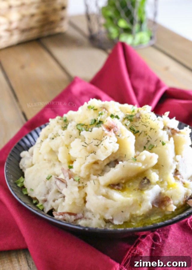 Effortless Slow Cooker Mashed Potatoes 8 Crock Pot Mashed Potatoes garnished with fresh dill.
