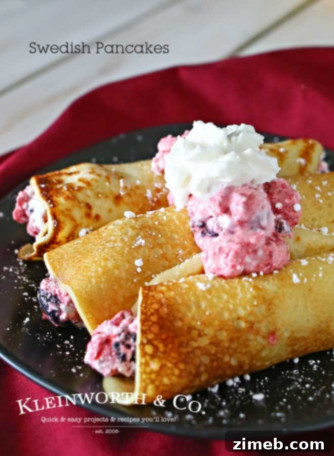 Swedish Crêpes 6 A stack of golden Swedish pancakes on a plate, garnished with fresh berries and whipped cream, ready to be enjoyed as a delightful breakfast or brunch.