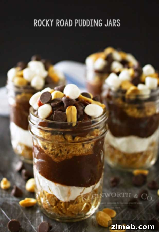 Vertical shot of several Rocky Road Pudding Jars, showcasing their appealing layers and tempting toppings, perfect for individual servings
