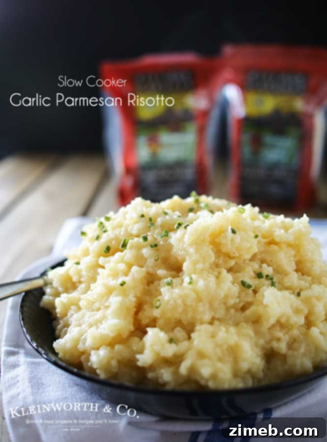 A bowl of creamy slow cooker Garlic Parmesan Risotto, garnished with fresh parsley.