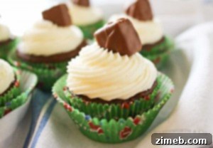 Delicious Game Day Snickers Cupcakes with buttercream frosting and Snickers minis.