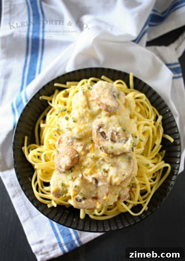 Cheddar Mushroom Linguine served in a bowl, ready to eat.