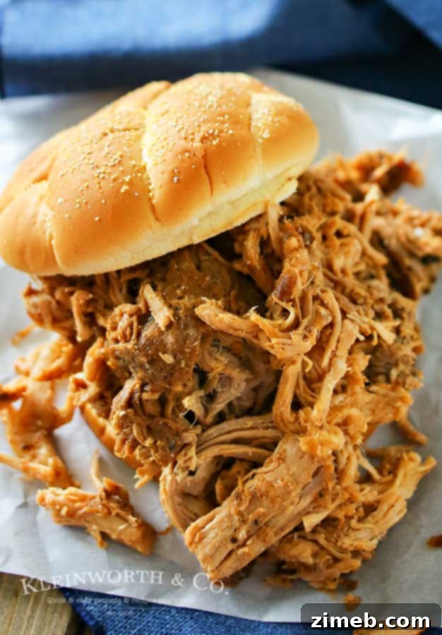 Guinness-Braised Pulled Pork 4 Close-up of succulent Guinness Pulled Pork, ready to be shredded and served.