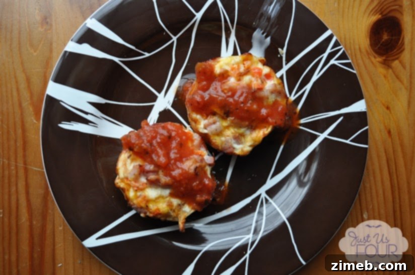 25 Delicious Egg Recipes 16 Southwestern Egg Muffins, baked in a muffin tin with colorful ingredients.
