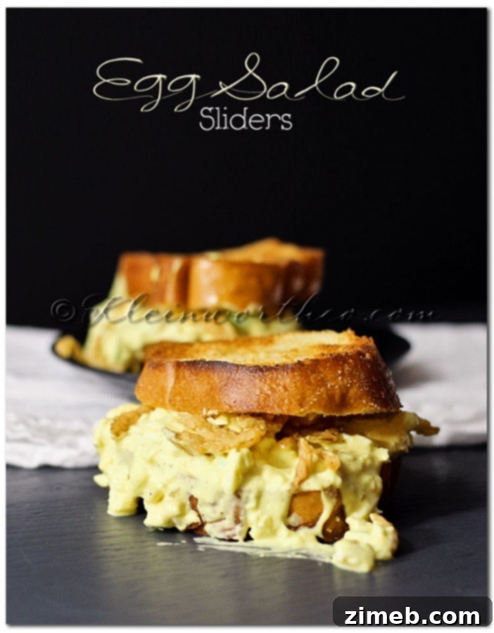 25 Delicious Egg Recipes 24 Mini Egg Salad Sliders on small buns, garnished with fresh dill.