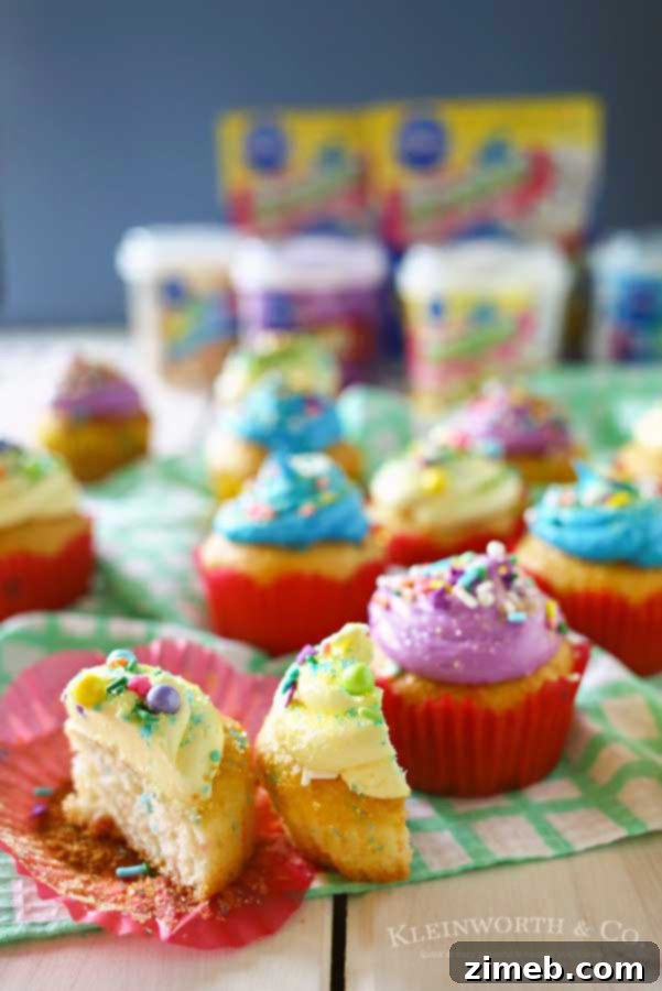 Easter Funfetti Cupcakes 5 Close-up of a hand holding a perfectly frosted Funfetti Easter cupcake