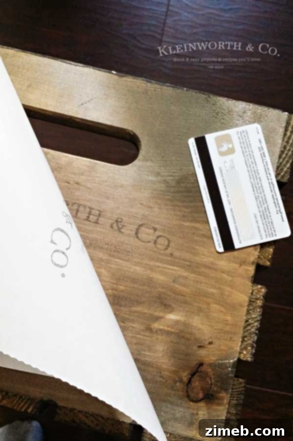 Crafting Vintage Crates: Effortless Image Transfer for Rustic Decor 5 Applying the image transfer to a stained wooden crate using a gift card