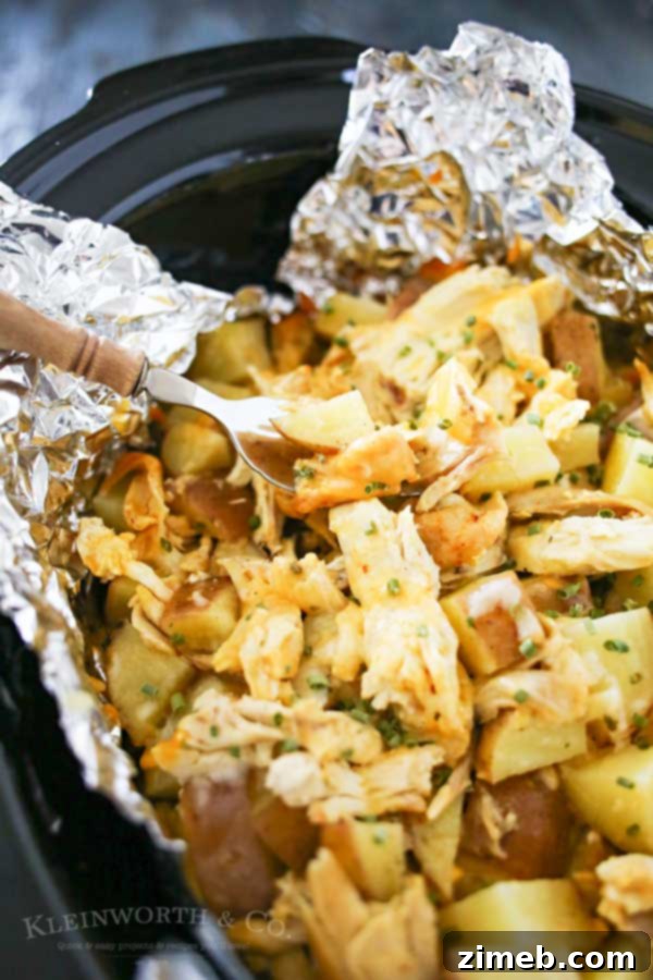 Side view of a serving of Cheesy Chicken Ranch Potatoes with fresh chives