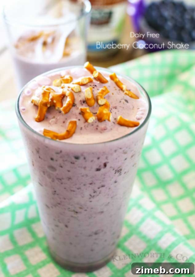 Vegan Blueberry Coconut Shake 7 A refreshing Blueberry Coconut Shake served in a glass with a straw.