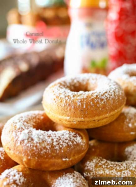 Caramel Whole Wheat Donuts are a lightened up version of the traditional baked cake donut recipe. Using whole wheat flour & just a dusting of confectioners sugar in place of frosting, they are perfect with your morning coffee or at your next brunch. Don't miss my tips for planning a coffee party too.