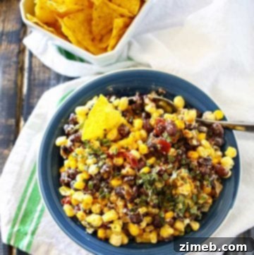 Street Corn Salsa 4 Delicious Mexican Corn Salsa with black beans, corn, peppers, and chiles, topped with lime crema and chives.