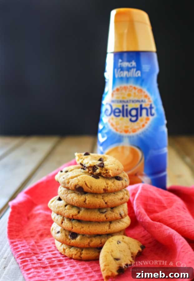 Up close image of a freshly baked Chocolate Chip Peanut Butter Cookie, showcasing its texture and mini chips
