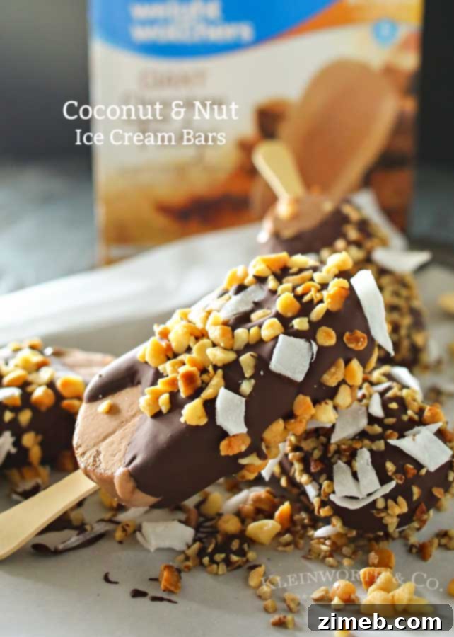 A plate of finished Coconut Nut Ice Cream Bars, glistening with chocolate and toppings.