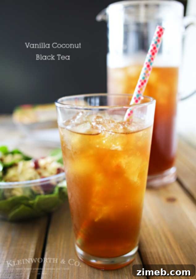 Sip and Savor: Vanilla Coconut Black Tea and Elevate Organic Salads 11 A final shot of the Vanilla Coconut Black Tea in a clear glass, glistening with condensation, inviting a taste.