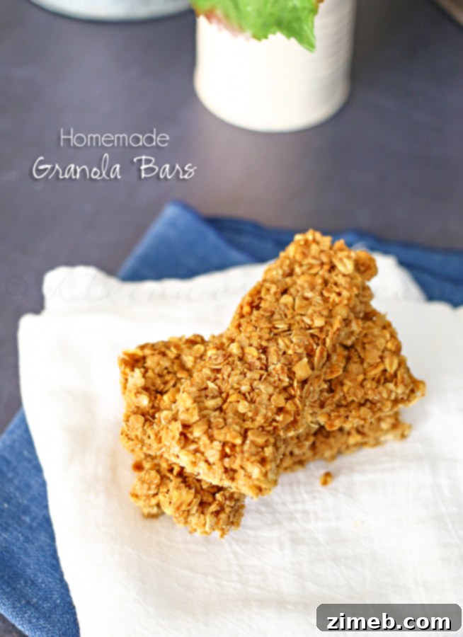 Delicious homemade granola bars with oats, nuts, and dried fruit, a perfect grab-and-go snack.