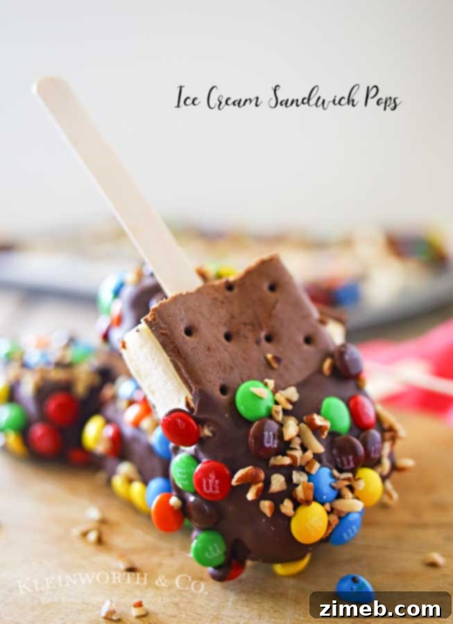 Irresistible Ice Cream Sandwich Pops 6 A child joyfully holding a decorated Ice Cream Sandwich Pop, with a blurred background of summer festivities.